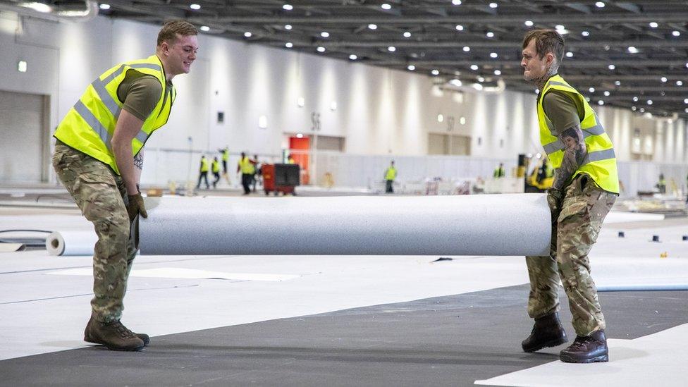 Soldiers from 1 Royal Anglian Regiment help construct the Nightingale Hospital at London's Excel conference centre