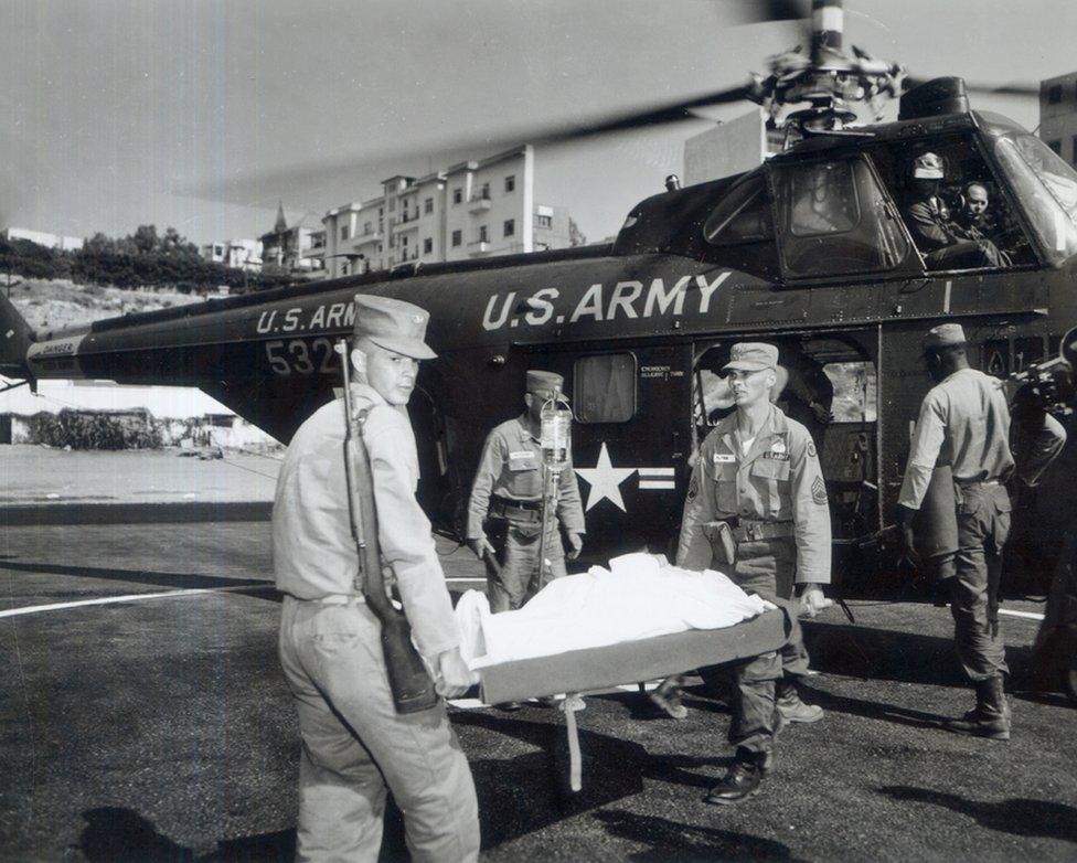 "Patient with polio is carried to ambulance" c. 1950s (SC 539538) OHA 343: US Army Signal Corps Photograph Collection. Otis Historical Archives. National Museum of Health and Medicine.