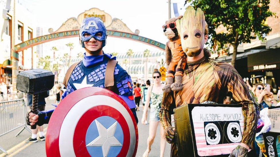 two-people-dressed-up-as-captain-america-and-groot