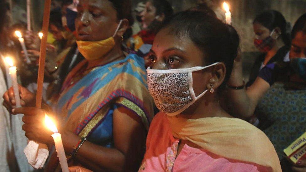 Workers of Mahila Congress (Women wing of the Indian National Congress) light candles during a protest against raped and brutally murdered 21-year-old Delhi Civil Defence (DCD) employee in New Delhi