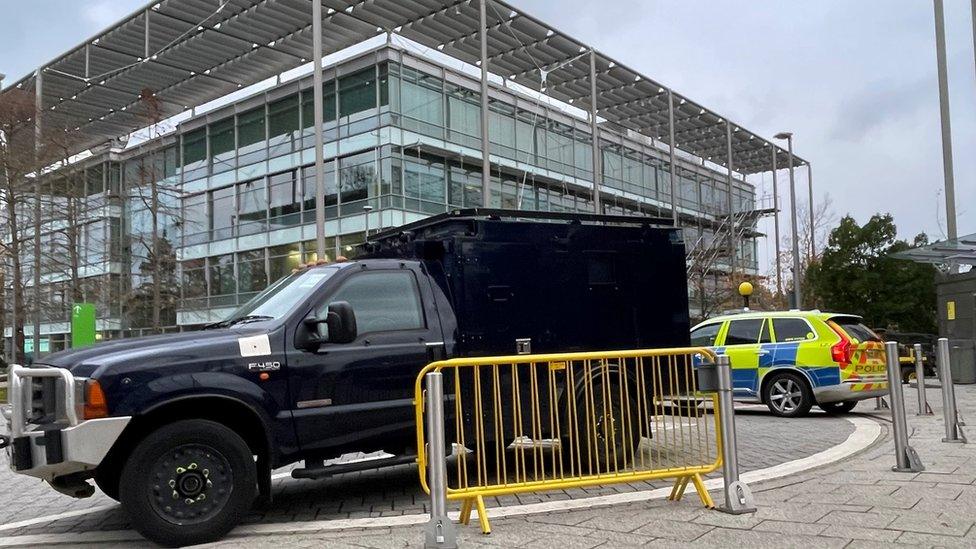 Armed Met Police vehicles guarding the offices of Iran International in Chiswick