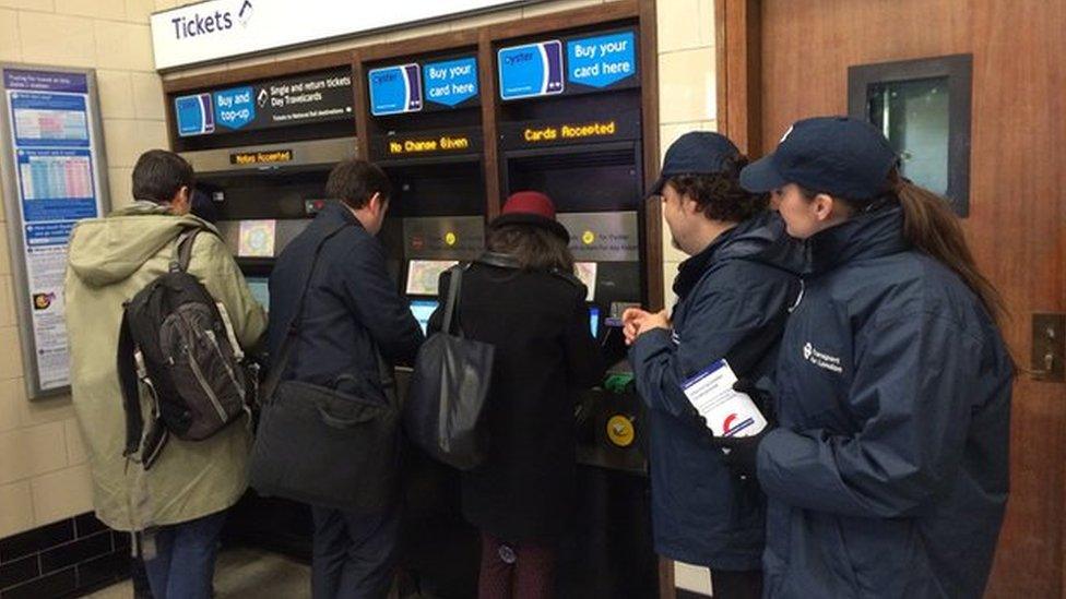 Customers buying tickets at Queensway ticket office