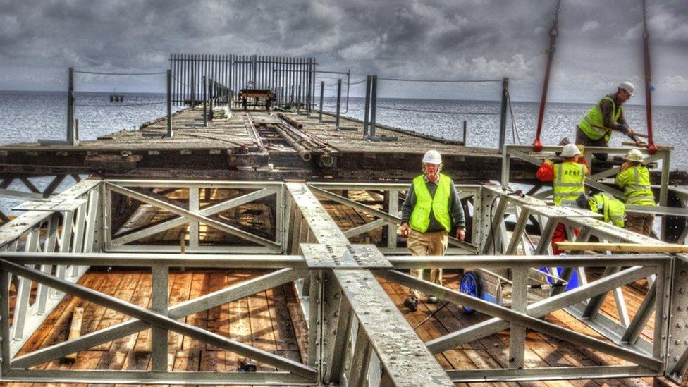 Volunteers working on the Queen's Pier restoration project