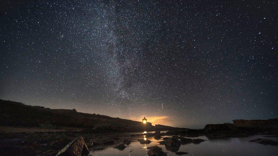 The Milky Way in the night sky above the Bathing House in Howick, Northumberland