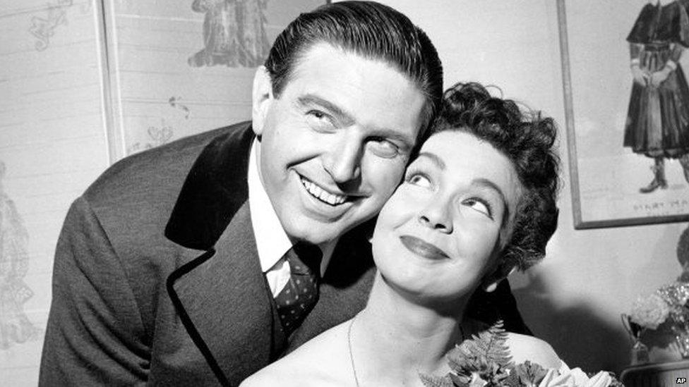 Renee Guerin, of Juneau, Alaska, poses with her co-star Theodore Bikel after their performance of The Sound of Music at the Lunt-Fontanne Theatre in New York City 12 May 1960