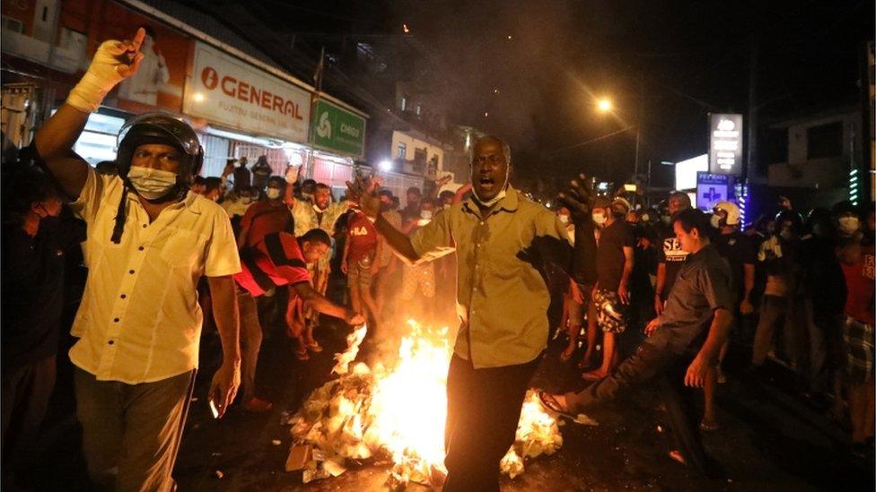 People shout slogans during a protest against the current economic crisis, outside the President's private residence in Colombo, Sri Lanka, 31 March 2022.