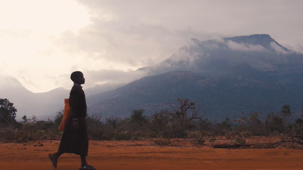 Child walking to school in Kenya