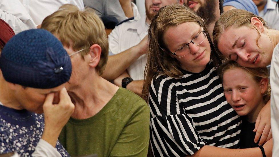 The mother (left) and family of Rina Shnerb mourn at her funeral in the Israeli town of Lod (23 August 2019)