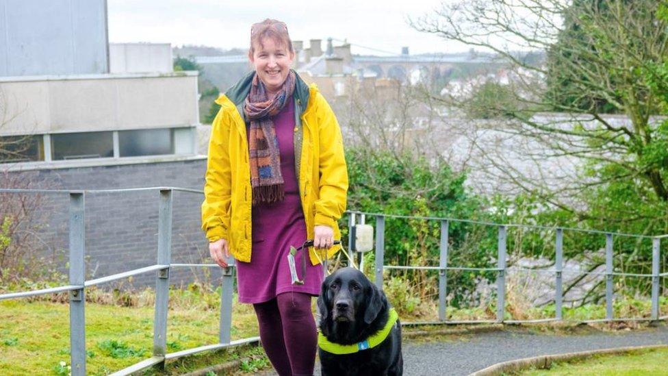 Rhiannon and her guide dog Jazz, who helps enable her to travel on trains and planes