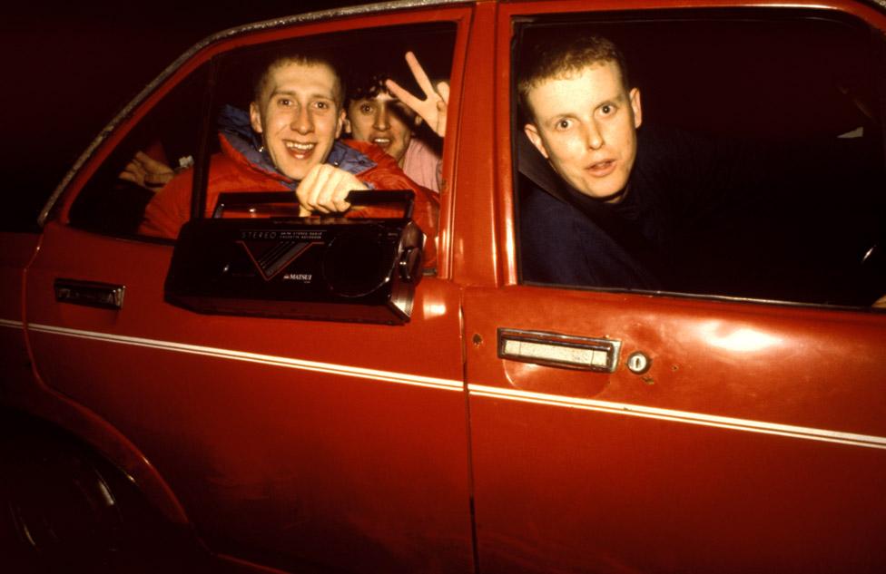 Ravers begin the drive home after a night at Shelleys, Sandbach Services, 1991