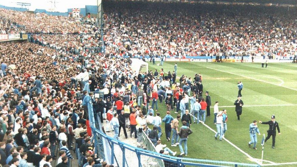 Fans escaping pens at the 1989 Hillsborough disaster