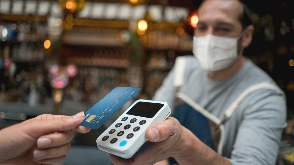 A server takes a contactless payment