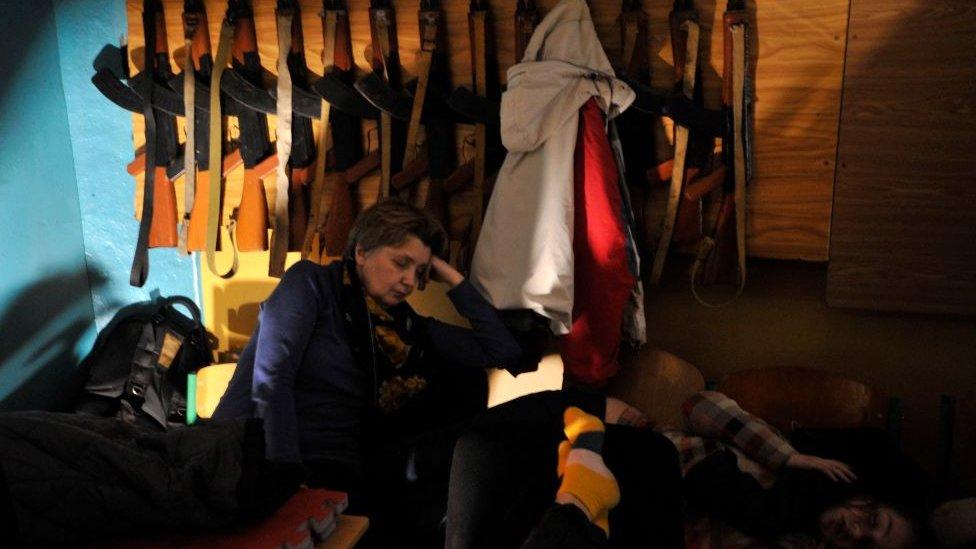 Woman in bomb shelter in Kyiv