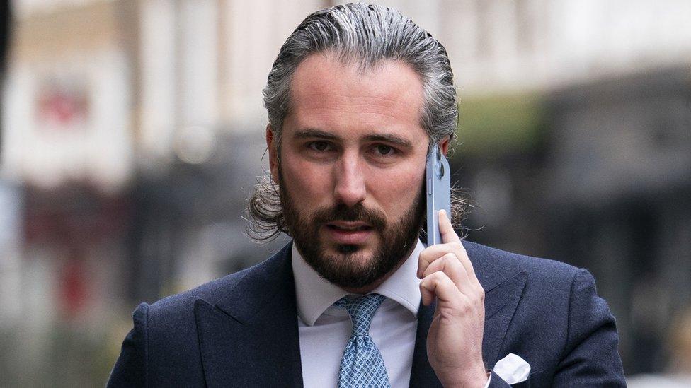 Ricky Lawrence on the phone outside the court