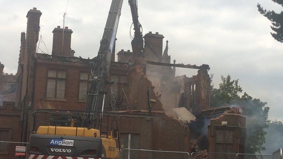 The old Little Plumstead Hospital being demolished