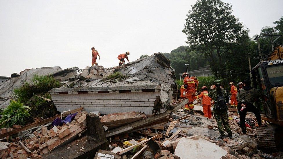 Rescue workers search for survivors after an earthquake hit Changning county in Yibin, Sichuan province, China, June 18, 2019