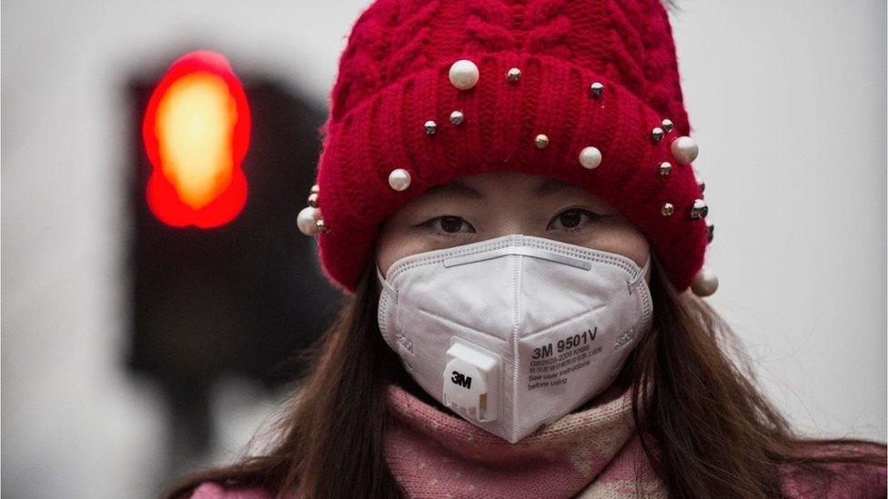 Woman wearing a face mask in China