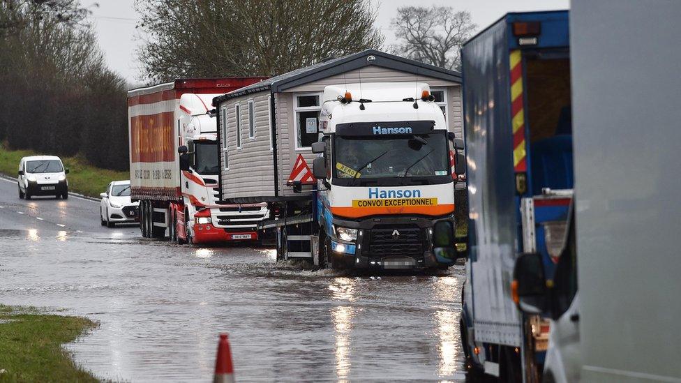 Drivers on a flooded Moira Road