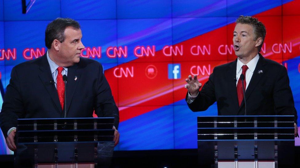 Republican presidential candidate U.S. Sen. Rand Paul (R-KY) (R) speaks as New Jersey Gov. Chris Christie listens during the CNN Republican presidential debate on December 15, 2015 in Las Vegas, Nevada.