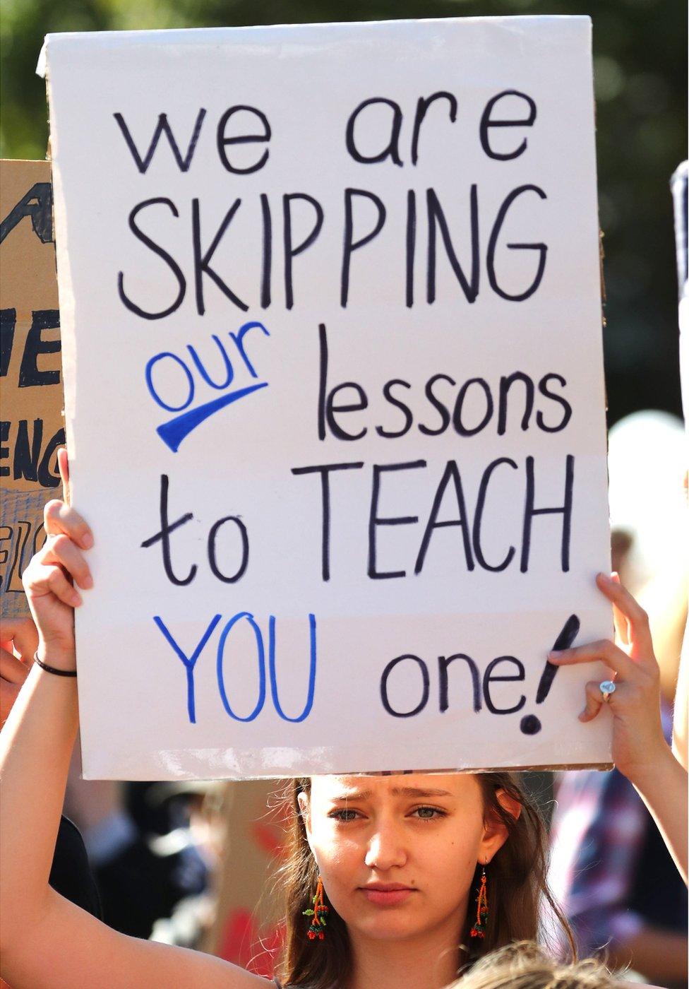 A protesters in London holding a placard