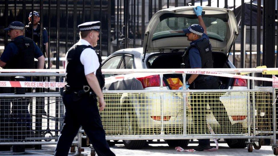 Police inspecting a car outside the Downing Street gates