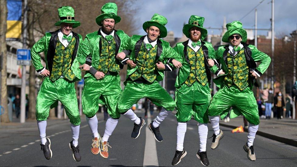 A group in fancy dress pose for a photo as Dubliners prepare to celebrate St Patrick's Day on March 17, 2022 in Dublin, Ireland. St Patrick's Day celebrations return to the streets of Dublin after a two-year absence, due to the Covid-19 pandemic.