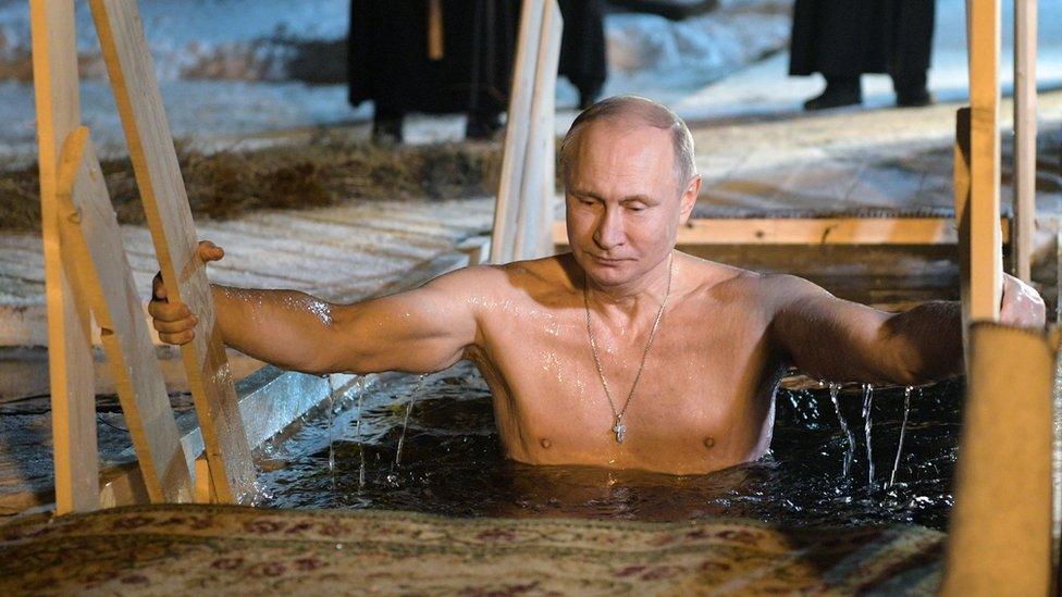 Vladimir Putin plunges into icy waters to celebrate the Epiphany holiday in January