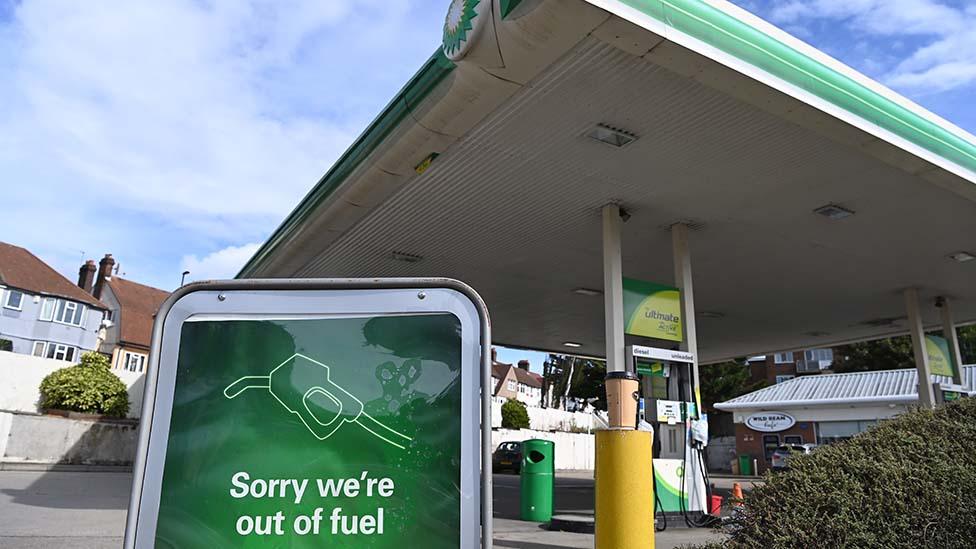 Petrol station in London, 4 October - sign says "sorry we're out of fuel"