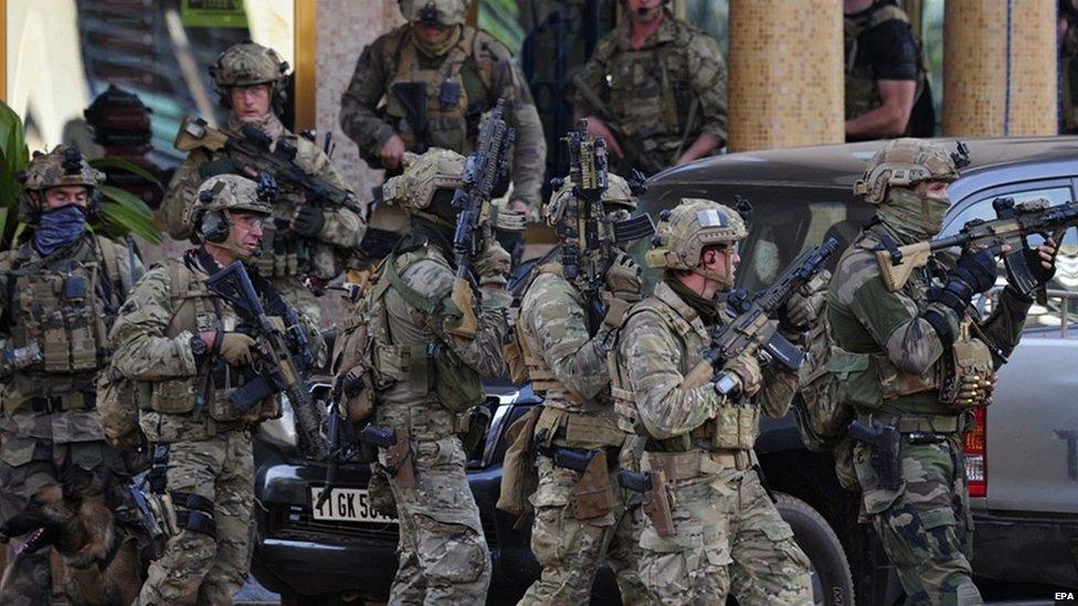 French forces take up positions outside the Splendid Hotel in Ouagadougou