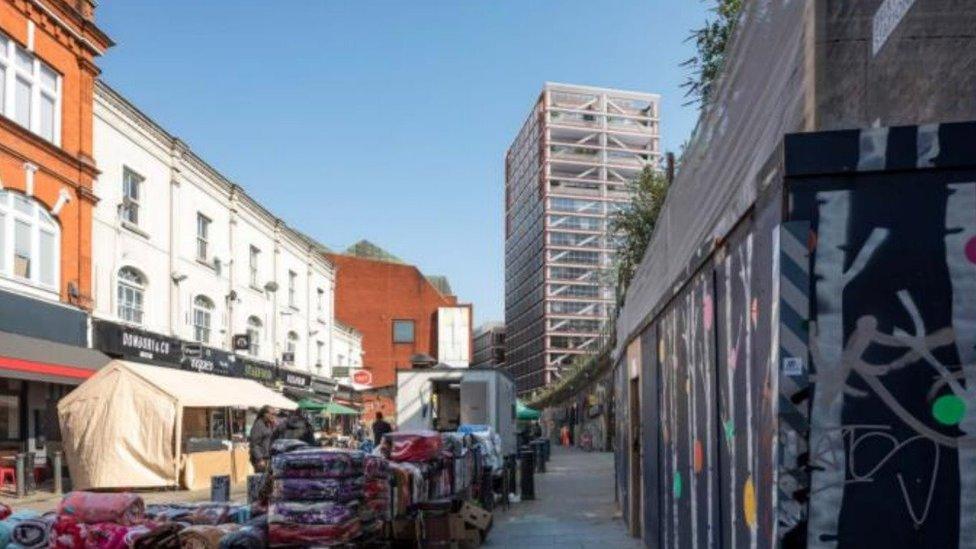 A CGI composite of Brixton Station Road, showing the elevation of the tower block high above surrounding buildings.