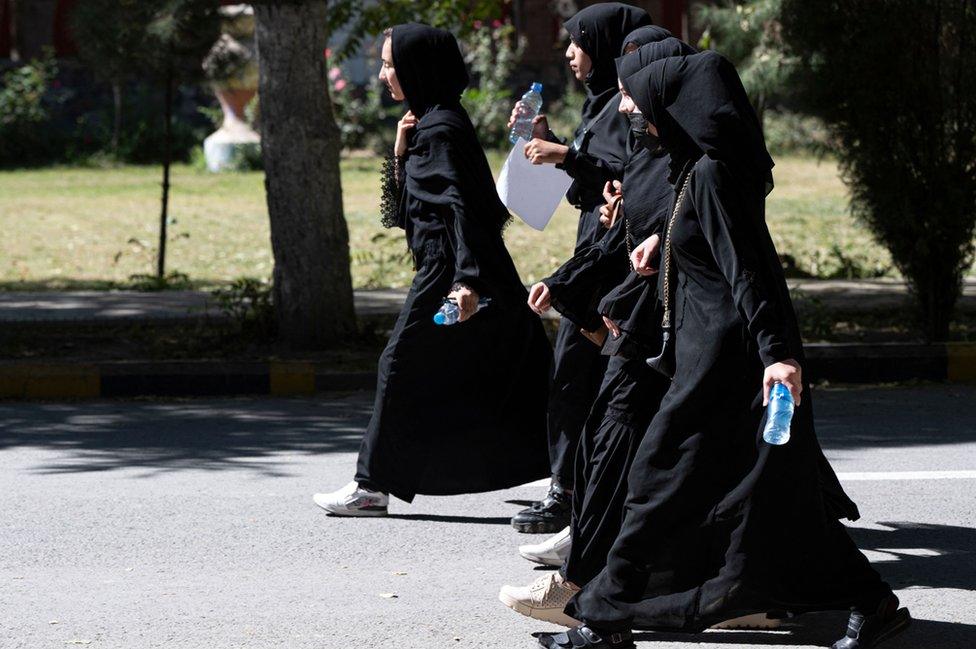 Afghan female students arrive for entrance exams at Kabul University in Kabul on October 13, 2022