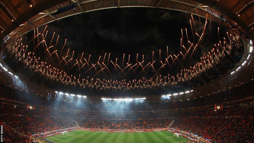 Fireworks explode as the Spain team celebrate victory with the World Cup trophy following the 2010 FIFA World Cup South Africa Final match between Netherlands and Spain at Soccer City Stadium on July 11, 2010 in Johannesburg, South Africa