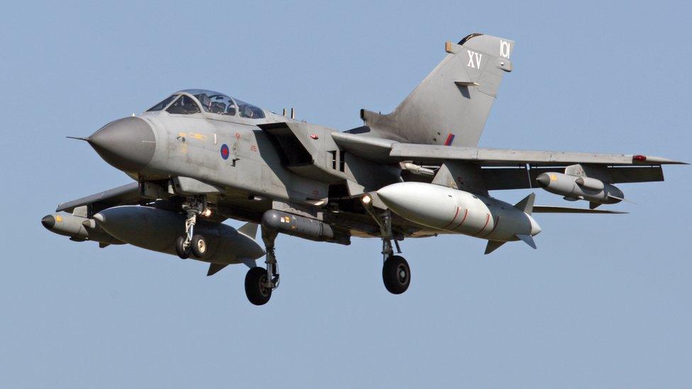 Armed British RAF Tornado combat aircraft, fighter plane in flight, 2011