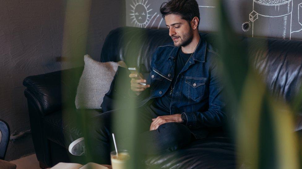 young man on phone