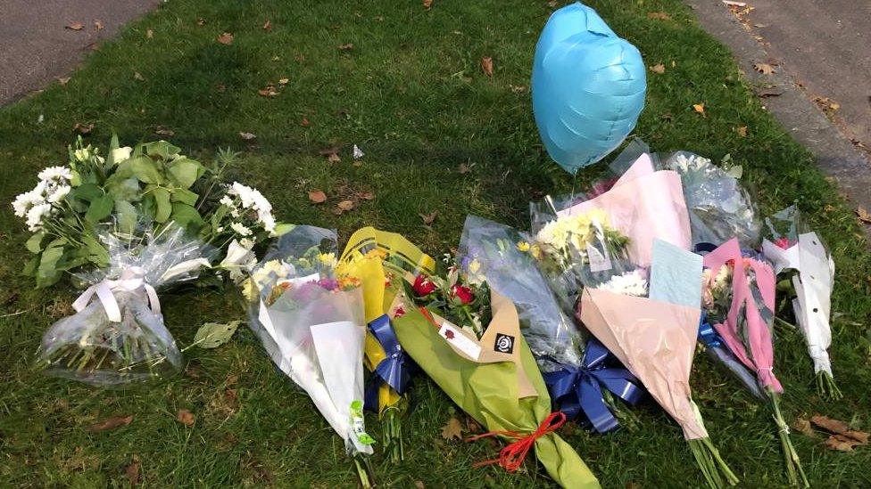 Flowers and tributes left at the scene.