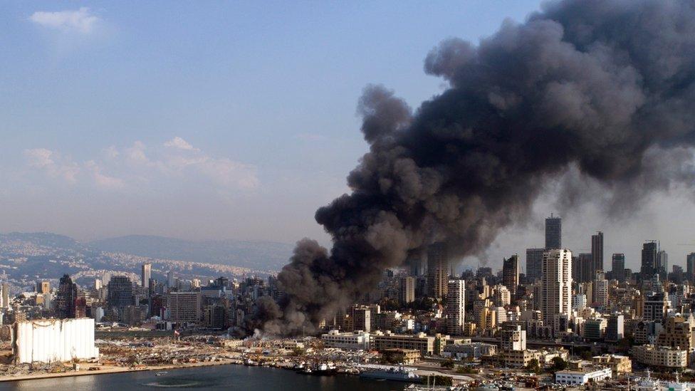 A picture taken with a drone shows thick smoke billowing over Beirut on 10 September 2020