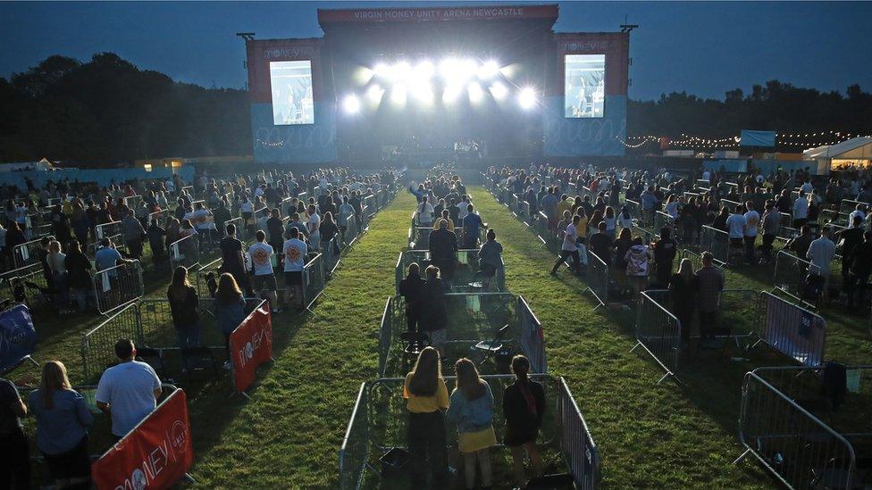 Fans in groups of up to five people watch Sam Fender at Gosforth Park