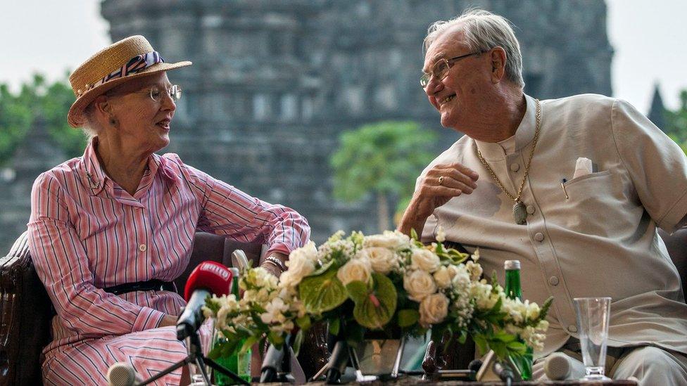 In this file photo taken on October 24, 2015 Danish Queen Margrethe II (L) and Prince Consort Henrik (R) visit the Prambanan temple during their visit to Yogyakarta