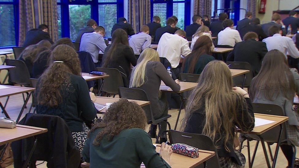 School pupils take an exam