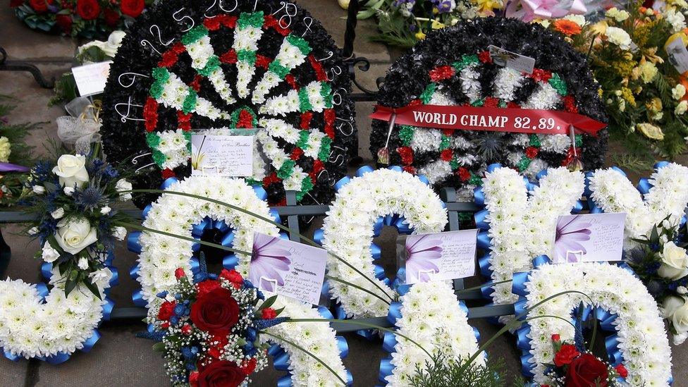 KIRKCALDY, SCOTLAND - APRIL 02: Floral tributes are laid outside Kirkcaldy crematorium following the funeral of the late Jocky Wilson on April 2, 2012 in Kirkcaldy. Mr Wilson had been suffering with a lung disorder chronic pulmonary obstructive disease passed away last Saturday at his home two days after his 62nd Birthday. He started his career in 1979 and was twice the World professional Darts Champion in 1982 and 1989. (Photo by Jeff J Mitchell/Getty Images)