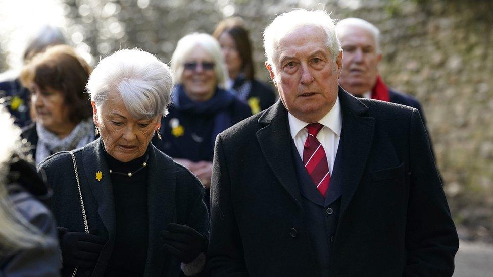 Sir Gareth Edwards arriving at cathedral with wife Maureen