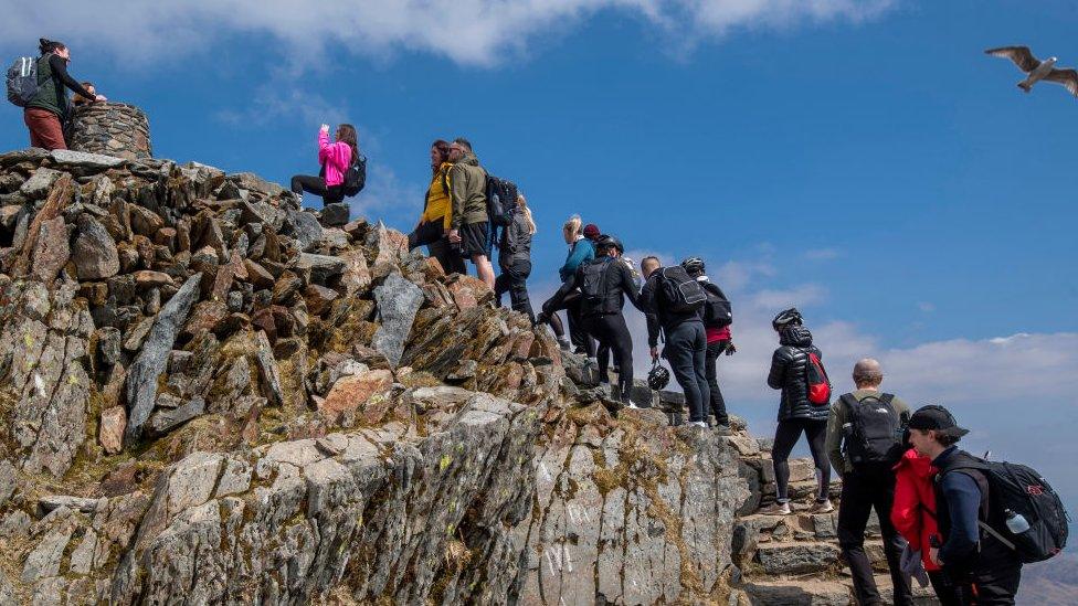 People queuing at the top of Snowdon