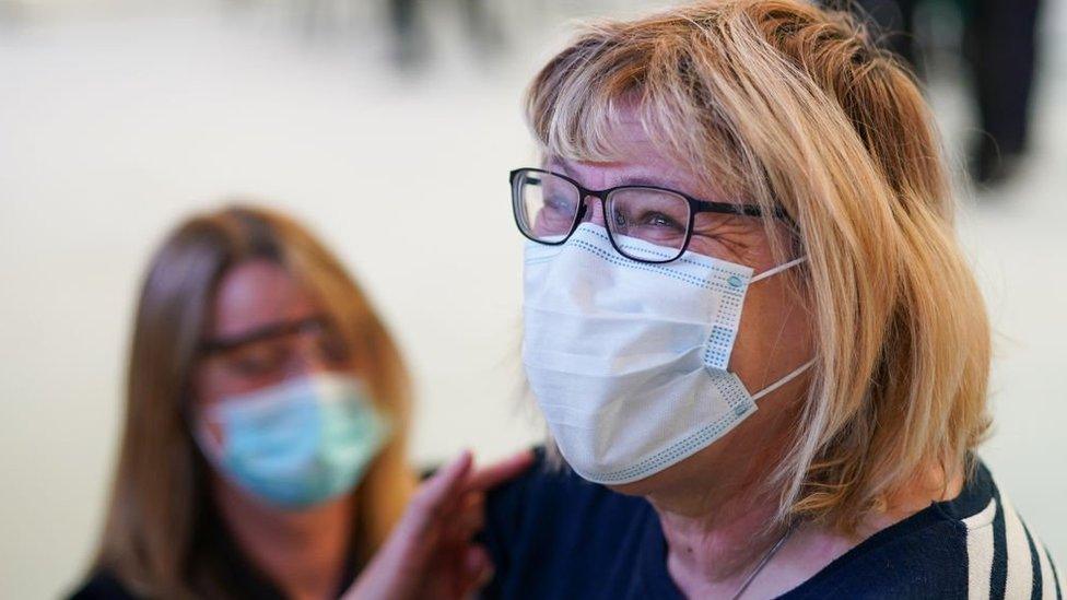 Woman being vaccinated