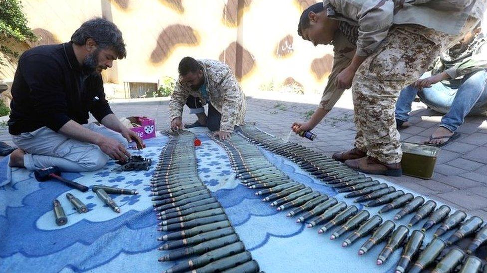 Fighters from a Misrata armed group loyal to the internationally recognised Libyan Government of National Accord (GNA) prepare their ammunition before heading to the frontline on 9 April 2019