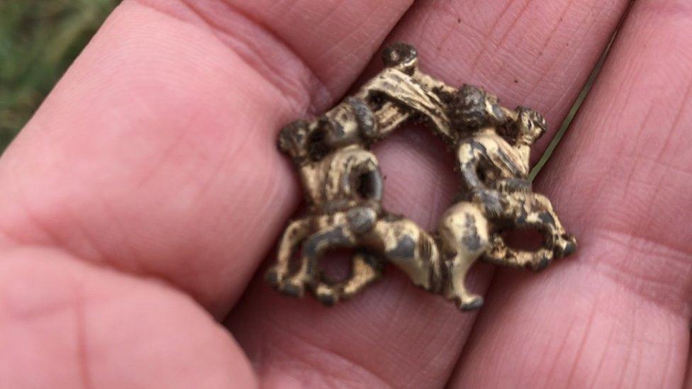 The brooch shortly after it was found