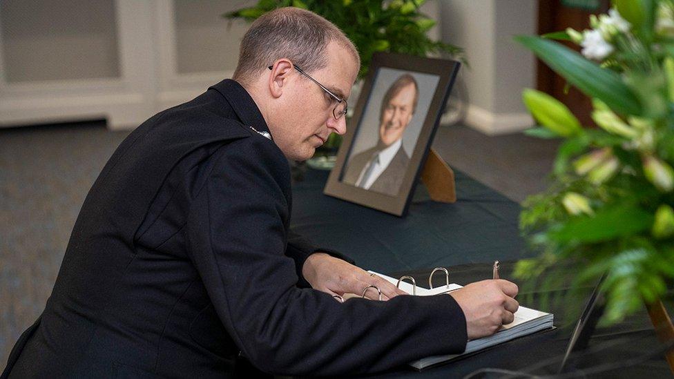 Ch Supt Simon Anslow signs the Book of Condolence for Sir David Amess MP in Southend