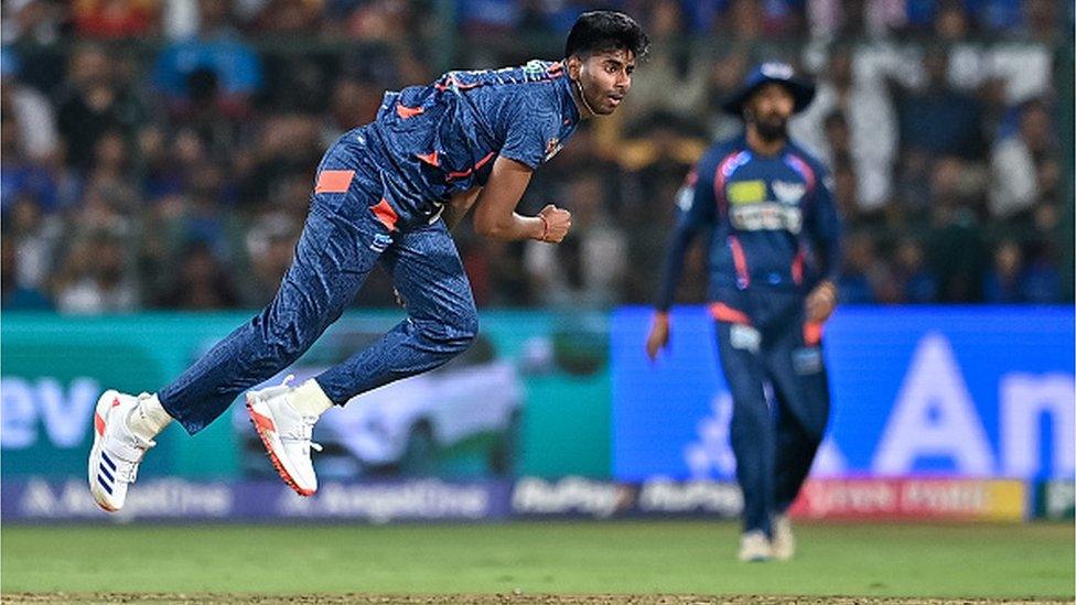 Lucknow Super Giants' Mayank Yadav bowls during the Indian Premier League (IPL) Twenty20 cricket match between Royal Challengers Bengaluru and Lucknow Super Giants at the M Chinnaswamy Stadium in Bengaluru on April 2, 2024