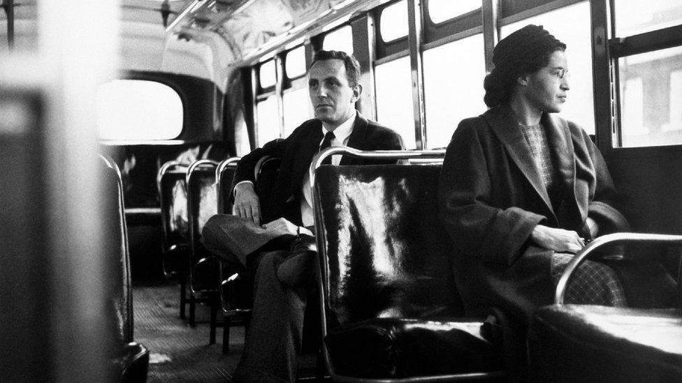 Rosa Parks sits in the front of a bus in Montgomery, Alabama, after the Supreme Court ruled segregation illegal on the city bus system on December 21st, 1956.