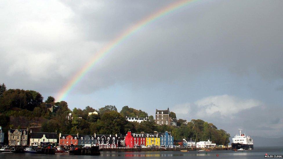 A rainbow over Tobermory Harbour in Scotland