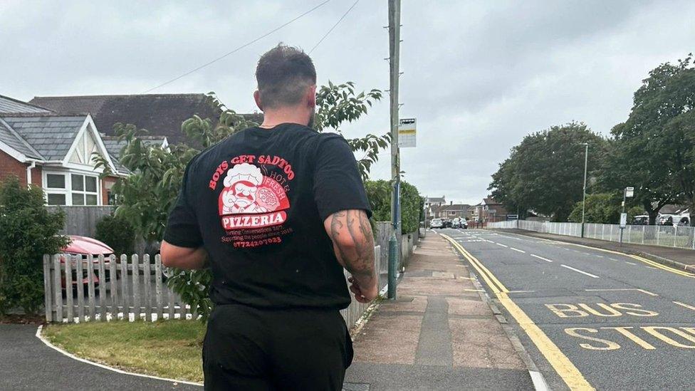 Jacob Burnham running down a street